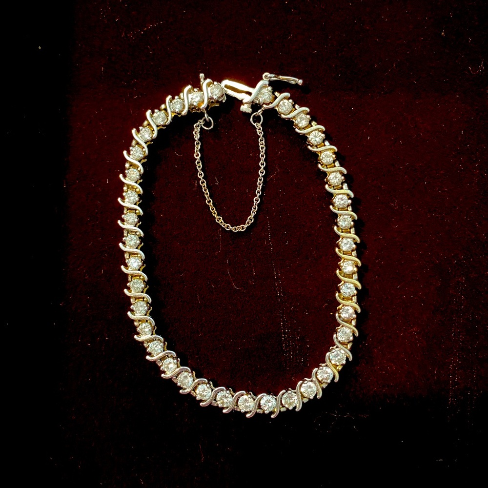 14kt gold natural diamond “S” link bracelet. 5.00 tcw